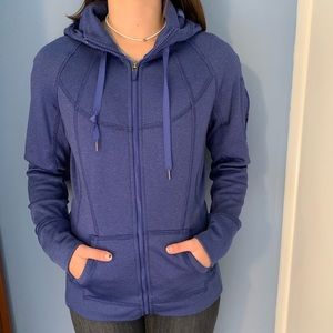 TANGERINE dark blue jacket with an arm pocket.